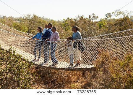 Multi Generation Family Crossing Rope Bridge Together