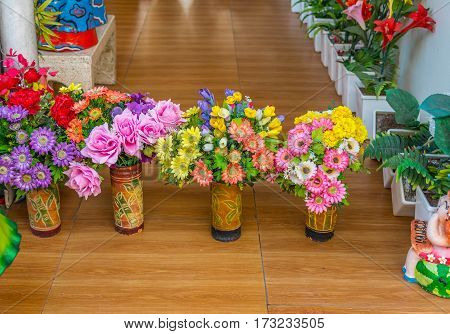 plastic decorative flower in garden waiting for sale