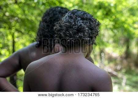 Vedda people walking in jungle. Veddas are an indigenous people of Sri Lanka living in tribes in the jungle