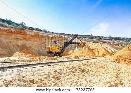 Sand quarry near the town of Orikhiv in Zaporizhzhia region of Ukraine. Excavator  electric power shovel  with bucket capacity of five cubic meters. September 2006