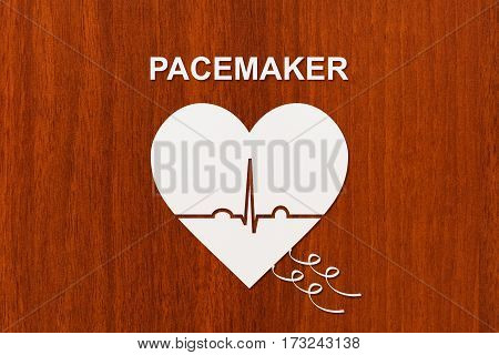 Heart shape with echocardiogram and PACEMAKER text. Medical cardiology concept