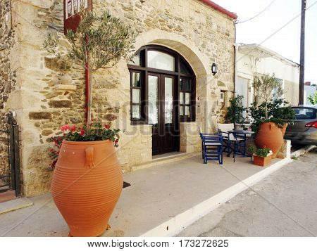 door architecture detail in house building with bougainvillaea Greece