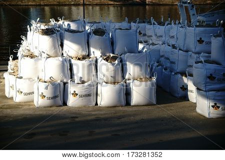 FRANKFURT, GERMANY - JANUARY 05: Bags of rubbish and excavation material standing on the banks of the river Main to salvage a bomb from World War 2 on January 05, 2017 in Frankfurt.