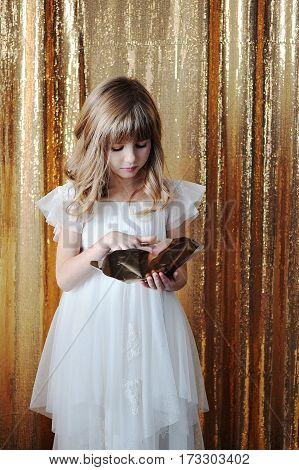 Young Girl With Golden Rose, In White Tenderless Dress On Golden Background