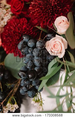 Autumnal Wedding Bouquet Of Roses, Apples, Grape And Pomergranate, In Red Colour, Closeup