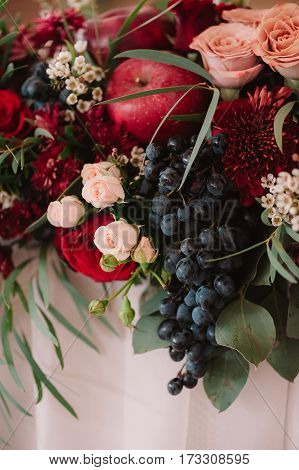 Autumnal Wedding Bouquet Of Roses, Apples, Grape And Pomergranate, In Red Colour, Closeup