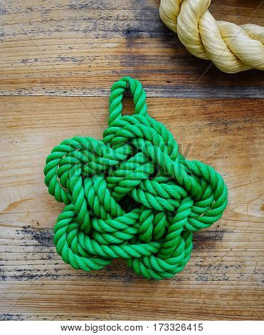 Rope knot hanging on the wooden wall for decoration in the Japanese temple.