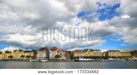 View on Strandvagen street on Ostermalm distric with touristic sightseeing boats in Stockholm Sweden