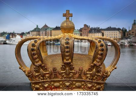 Skeppsholmsbron (Skeppsholm Bridge) with Golden Crown on a bridge in Stockholm Sweden