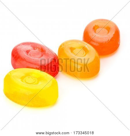 Four colorful fruit hard sugar candies,  boiled sweeties or sugar plums isolated on white background cutout
