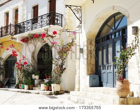 door architecture detail in house building with bougainvillea Greece