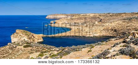 Gozo Malta - The famous Azure Window with the Fungus rock and Dwejra bay on a beautiful summer day with clear blue sky