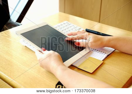 Woman's Hands Holding Credit Card And Using Laptop. Online Shopping