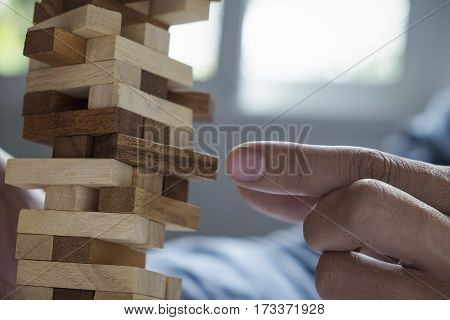 A Male Hand Stopping The Domino Effect. Retro Style Image Executive And Risk Control Concept