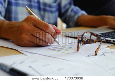 Business Man Hand Pointing At Business Document During Discussion At Meeting