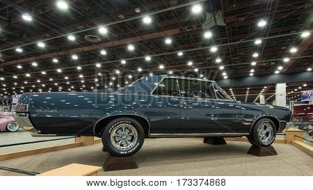DETROIT MI/USA - February 24 2017: A 1965 Pontiac GTO car restoration on display at the Detroit Autorama, a showcase of custom and restored cars.