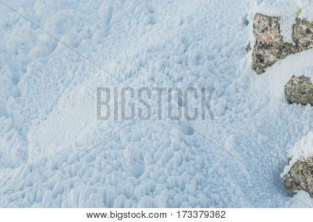 Weathered texture of snow in the mountains.