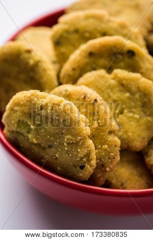 Tasty North Indian snack mathri or mathari served with pickle. Selective focus photograph.