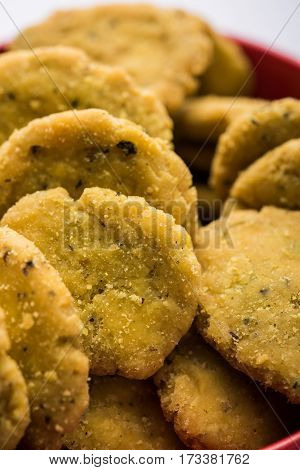 Tasty North Indian snack mathri or mathari served with pickle. Selective focus photograph.