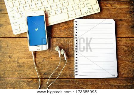 CHIANGMAI THAILAND -Aoril 14 2016: Apple iPhone open Twitter applicationTwitter is an online social networking and microblogging service that enables users to send and read 