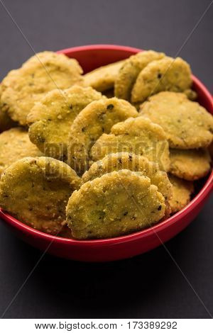 Tasty North Indian snack mathri or mathari served with pickle. Selective focus photograph.