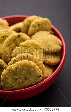 Tasty North Indian snack mathri or mathari served with pickle. Selective focus photograph.