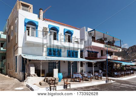 PALEOCHORA, CRETE, GREECE - JUNE 2016: Traditional Greeke with house with tavern on first fool.