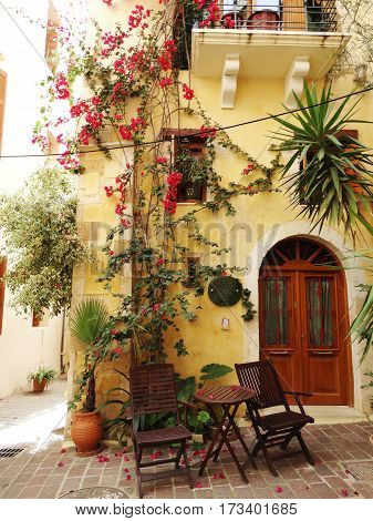 door architecture detail in house building with bougainvillea Greece