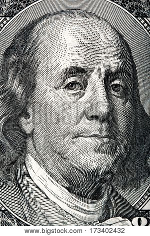 Portrait of Benjamin Franklin on the hundred dollar bill.