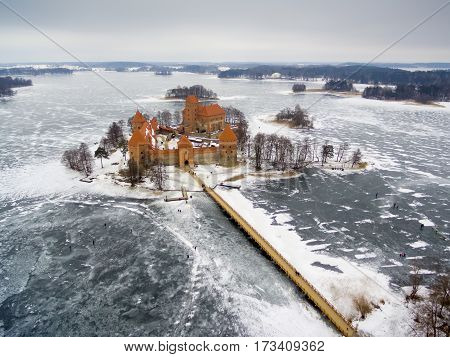 Trakai, Lithuania: aerial winter UAV top view, flat lay of gothic Island Castle. Historical residence in capital city of Grand Duchy of Lithuania, located in Galve lake