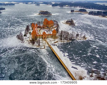 Trakai, Lithuania: aerial winter UAV top view, flat lay of gothic Island Castle. Historical residence in capital city of Grand Duchy of Lithuania, located in Galve lake