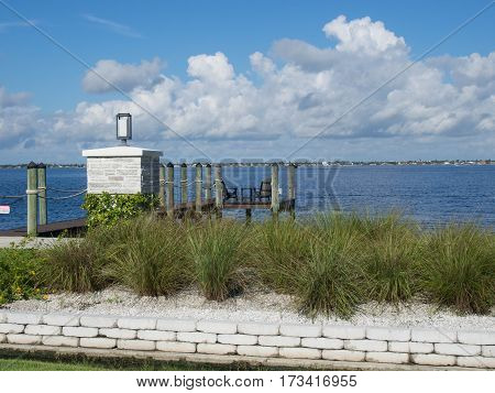 Tranquil Setting - Chairs at the end of a Dock along the Caloosahatchee River near Downtown Fort Myers Florida