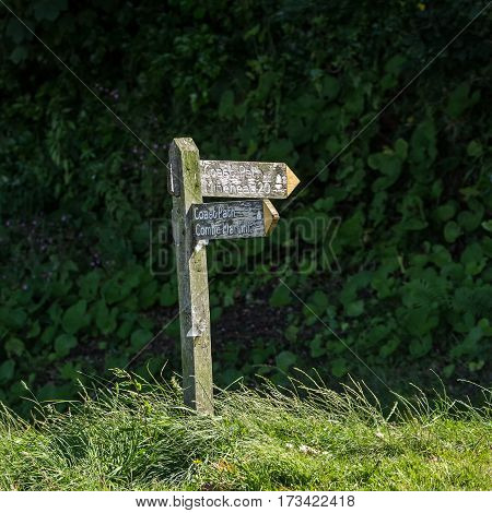 old wooden signpost for backpackers. Lynmouth. North Devon. UK