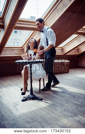 Happy romantic couple in love bonding in cafe
