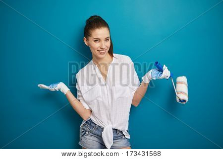 bright picture of lovely housewife painting at home