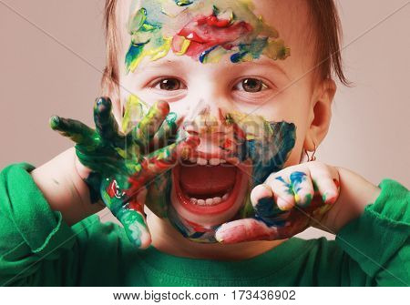 beautiful little baby girl draws a picture paints (postmodernism talent creativity creativity)