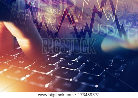 Forex Online Player. Forex Currency Trading Online Concept with Hands on the Laptop and Trading Stats.