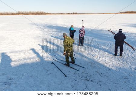Group Of People Skiing.