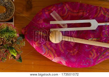 tuning fork and crystal on table .