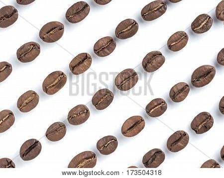 Diagonal rows of coffee beans closeup on white background. Top view or flat lay