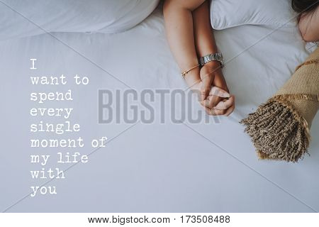 Inspirational quotes about love. Hand in hand of young couple background. I want to spend every mingle moment of my life with you.