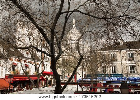 PARIS FRANCE - APRIL 16 2016: Basilica of Sacre Coeur and Place du Tertre on Montmartre hill.