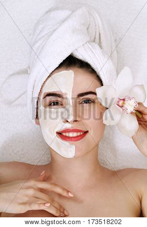 Young beautiful woman with a mask on his face