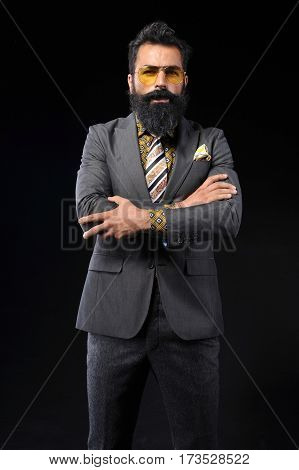 young handsome man wear gray suit on black background