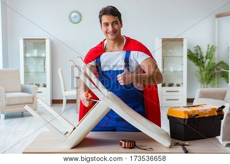 Super hero repairman working at home