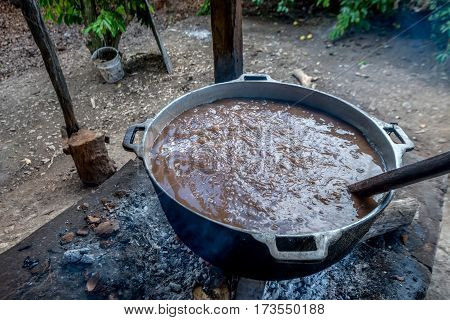 Close-up of homemade rustic traditional Dominican pottage in cauldron