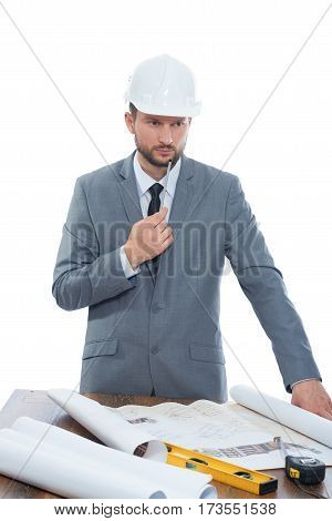 New ideas needed Vertical studio shot of a male businessman engineer working on a building project thinking looking concentrated inspiration professionalism ideas brainstorm business concept