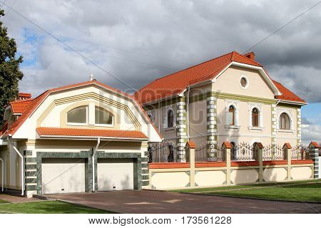 BORISOGLEBSK VORONEZH OBLAST RUSSIA- JULY 21 2015: Modern cottage and garage with a tiled roof in the town of Borisoglebsk Voronezh region. Russia.