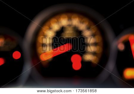Blurred Speed Gauge in car. Abstract background.