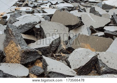 Broken asphalt on the street made for digging trenches for laying of communications in the city